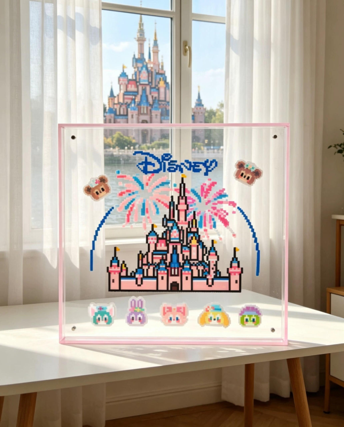Handmade pink fairytale castle pixel bead acrylic frame displayed by a sunny window