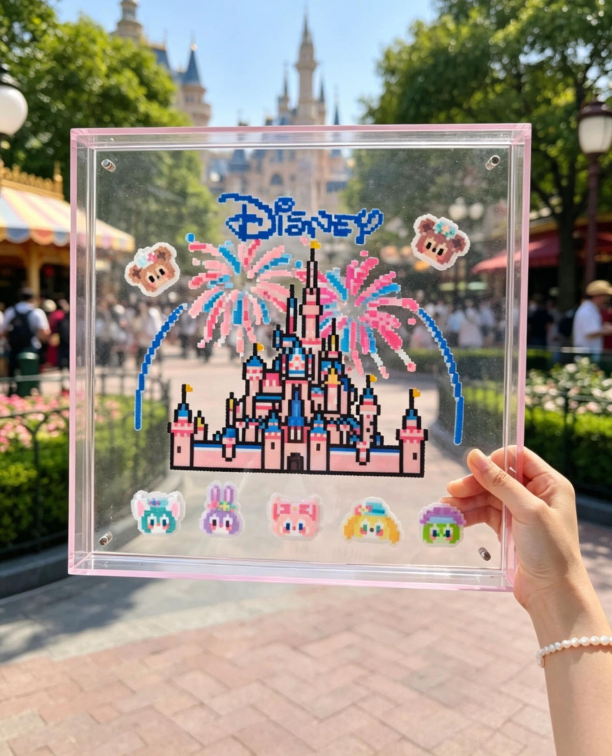 Pink fairytale castle pixel bead acrylic frame photographed outdoors